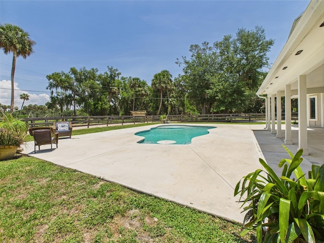 2045 SW 18th Ln, Okeechobee, FL 34974 - view of pool featuring a patio, a fenced backyard, and view of wooded area