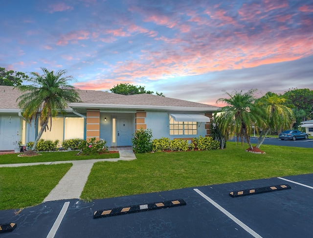517 SE Crooked Lake Ln Unit D, Fort Pierce, FL 34982 - single story home featuring uncovered parking, a lawn, and stucco siding