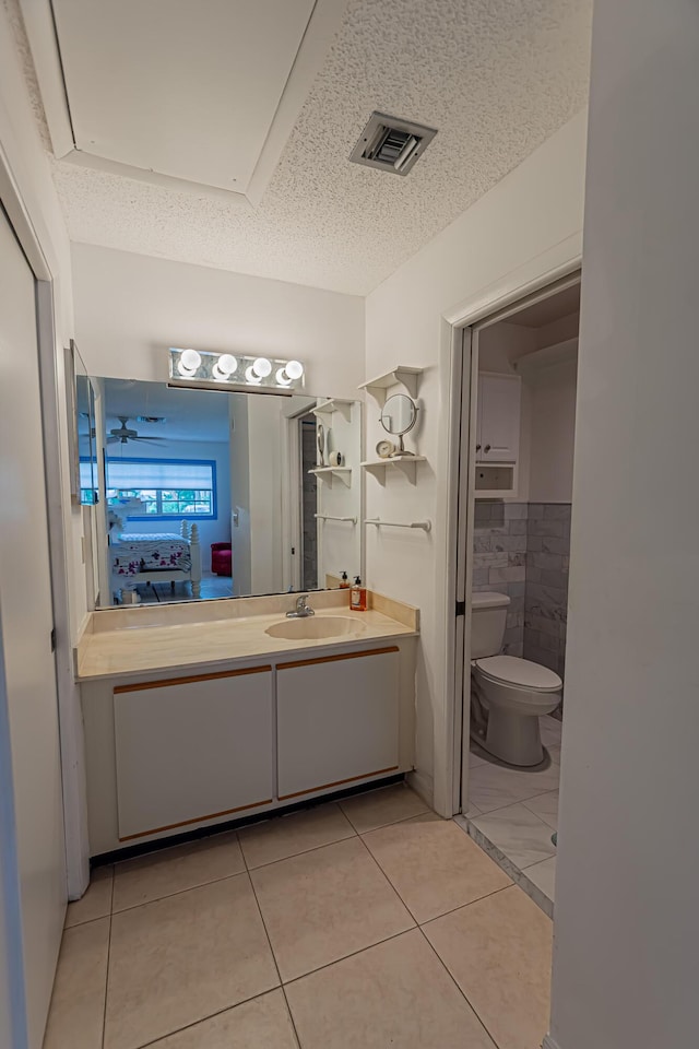 517 SE Crooked Lake Ln Unit D, Fort Pierce, FL 34982 - bathroom with tile patterned floors, toilet, and vanity