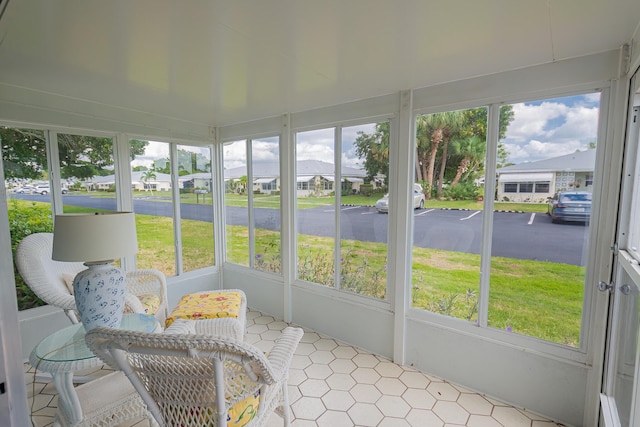 517 SE Crooked Lake Ln Unit D, Fort Pierce, FL 34982 - sunroom featuring plenty of natural light and a residential view