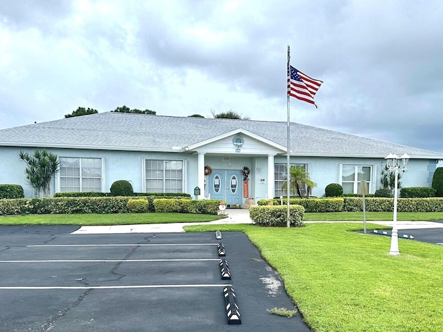 517 SE Crooked Lake Ln Unit D, Fort Pierce, FL 34982 - view of building exterior featuring uncovered parking