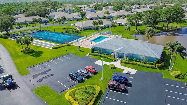 517 SE Crooked Lake Ln Unit D, Fort Pierce, FL 34982 - drone / aerial view of a pool and a large body of water
