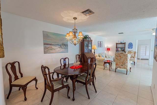 517 SE Crooked Lake Ln Unit D, Fort Pierce, FL 34982 - dining area with a chandelier, light tile patterned floors, and a textured ceiling