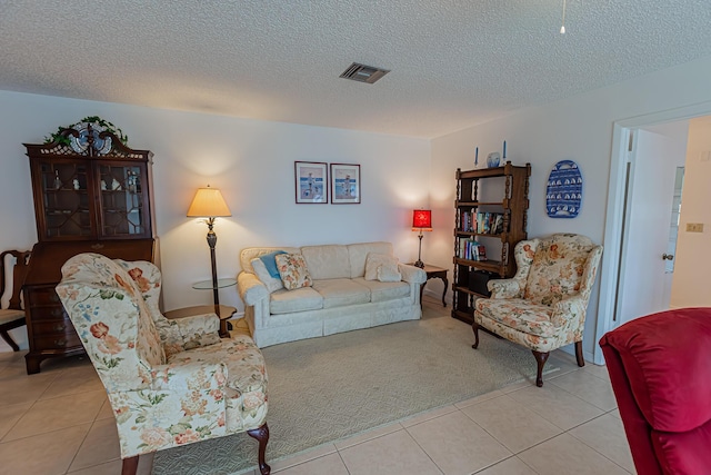 517 SE Crooked Lake Ln Unit D, Fort Pierce, FL 34982 - tiled living area featuring a textured ceiling