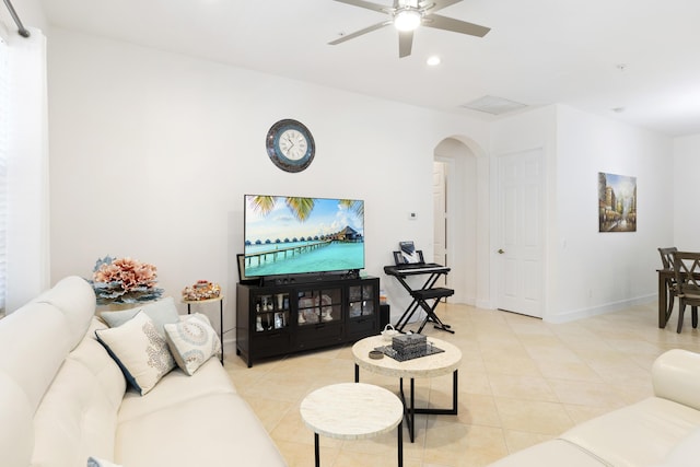 10171 SW Dolce Rd, Port Saint Lucie, FL 34986 - living room with arched walkways, ceiling fan, light tile patterned floors, recessed lighting, and baseboards