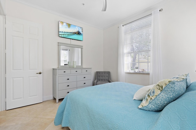 10171 SW Dolce Rd, Port Saint Lucie, FL 34986 - bedroom with ornamental molding, light tile patterned floors, multiple windows, a ceiling fan, and baseboards
