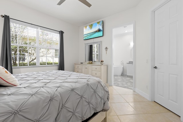 10171 SW Dolce Rd, Port Saint Lucie, FL 34986 - bedroom featuring light tile patterned floors, ensuite bathroom, ceiling fan, and baseboards