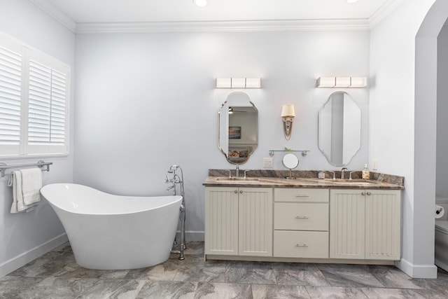 10171 SW Dolce Rd, Port Saint Lucie, FL 34986 - bathroom featuring ornamental molding, baseboards, double vanity, and a soaking tub