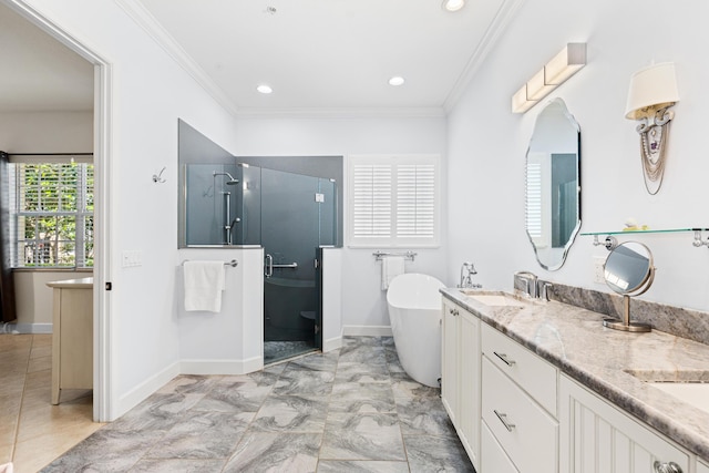 10171 SW Dolce Rd, Port Saint Lucie, FL 34986 - bathroom featuring a shower stall, a soaking tub, crown molding, double vanity, and baseboards