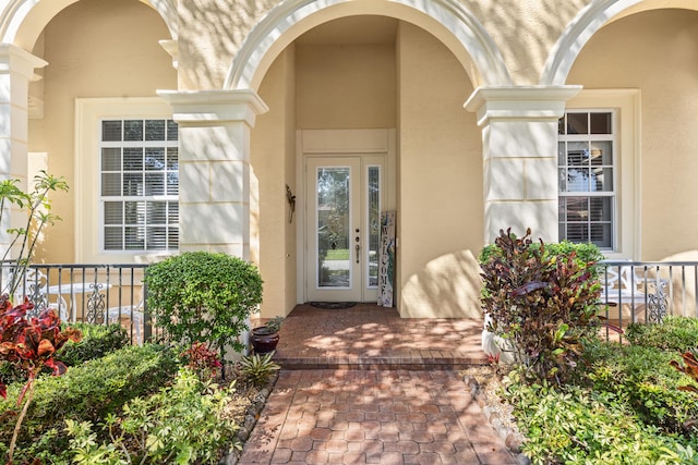 10171 SW Dolce Rd, Port Saint Lucie, FL 34986 - entrance to property with stucco siding and covered porch