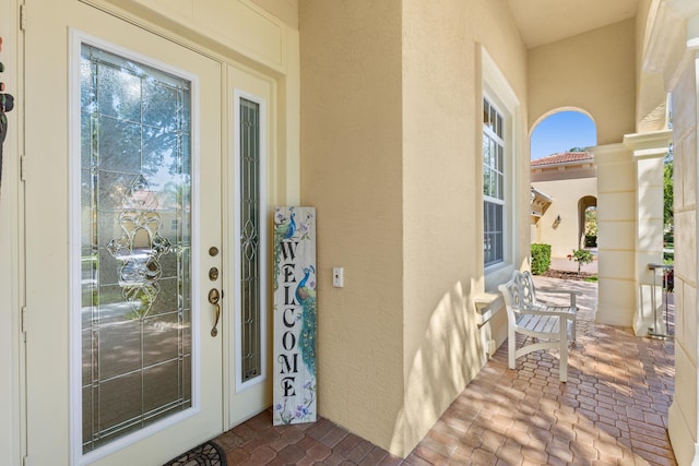 10171 SW Dolce Rd, Port Saint Lucie, FL 34986 - property entrance with stucco siding