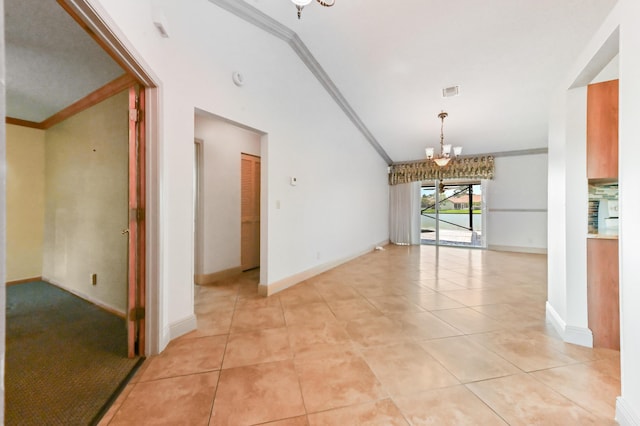 8586 Brian Blvd, Boynton Beach, FL 33472 - empty room featuring a chandelier, crown molding, light tile patterned floors, baseboards, and vaulted ceiling