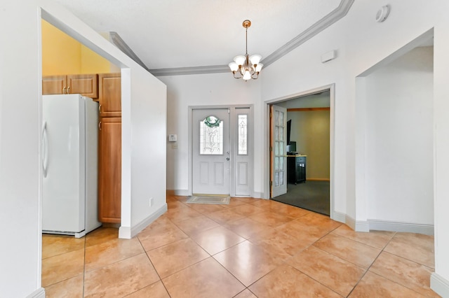 8586 Brian Blvd, Boynton Beach, FL 33472 - entryway featuring a chandelier, light tile patterned flooring, crown molding, and baseboards