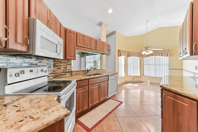 8586 Brian Blvd, Boynton Beach, FL 33472 - kitchen with white appliances, a sink, vaulted ceiling, decorative backsplash, and a ceiling fan