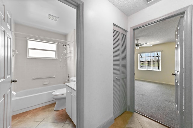 8586 Brian Blvd, Boynton Beach, FL 33472 - full bath with a textured ceiling, toilet, bathing tub / shower combination, tile patterned floors, and a ceiling fan