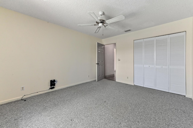 8586 Brian Blvd, Boynton Beach, FL 33472 - unfurnished bedroom featuring carpet flooring, a textured ceiling, baseboards, a closet, and a ceiling fan
