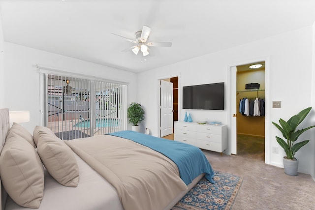 8586 Brian Blvd, Boynton Beach, FL 33472 - bedroom featuring a walk in closet, light carpet, baseboards, a closet, and a ceiling fan