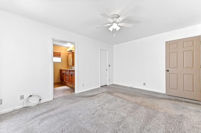 8586 Brian Blvd, Boynton Beach, FL 33472 - unfurnished bedroom with carpet flooring, baseboards, connected bathroom, and a ceiling fan