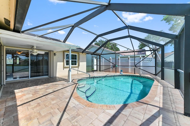8586 Brian Blvd, Boynton Beach, FL 33472 - view of swimming pool featuring a patio, ceiling fan, and glass enclosure