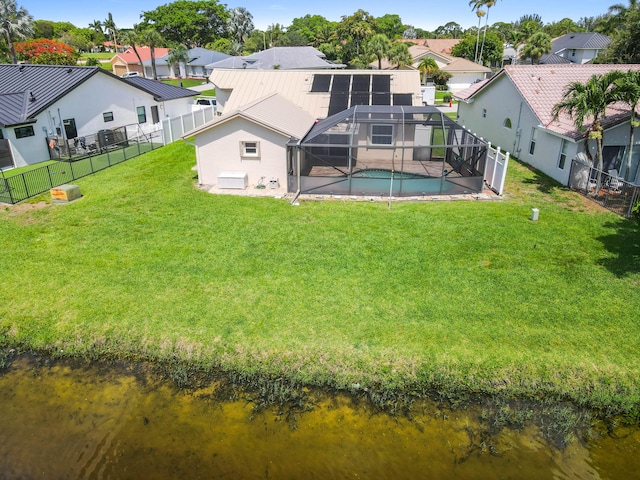 8586 Brian Blvd, Boynton Beach, FL 33472 - rear view of property featuring a residential view, a patio area, metal roof, and glass enclosure