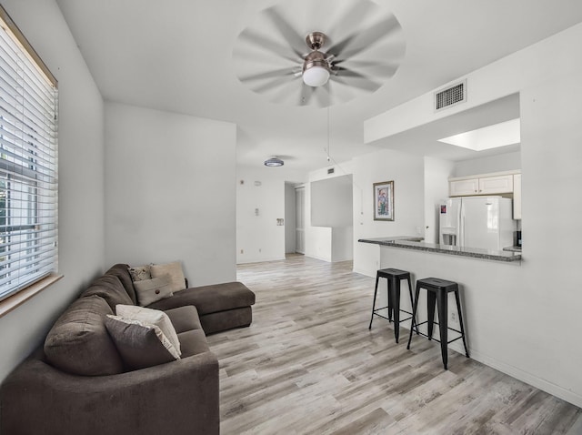 10520 SW Stephanie Way Unit 2-202, Port Saint Lucie, FL 34987 - living area featuring ceiling fan and light wood-type flooring