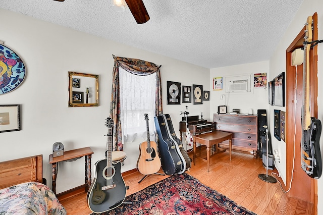 1328 SE 3rd Ave, Deerfield Beach, FL 33441 - office area featuring wood finished floors, a textured ceiling, a ceiling fan, and a wall mounted AC