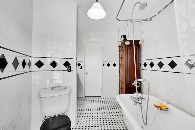 1328 SE 3rd Ave, Deerfield Beach, FL 33441 - bathroom with tile walls, a freestanding bath, and toilet