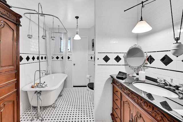 1328 SE 3rd Ave, Deerfield Beach, FL 33441 - full bathroom featuring tile walls, a soaking tub, vanity, and a tile shower