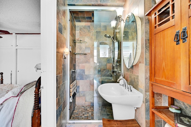 1328 SE 3rd Ave, Deerfield Beach, FL 33441 - full bathroom featuring a stall shower, tile walls, and a textured ceiling