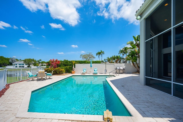 6051 NW 24th Ter, Boca Raton, FL 33496 - view of swimming pool with a patio area, a fenced backyard, and grilling area