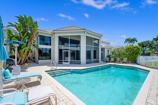 6051 NW 24th Ter, Boca Raton, FL 33496 - view of swimming pool with a patio and a sunroom