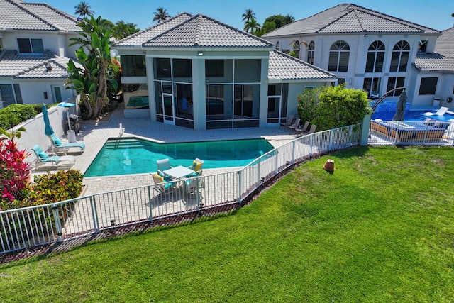 6051 NW 24th Ter, Boca Raton, FL 33496 - rear view of house with a tile roof, a sunroom, a patio, and stucco siding