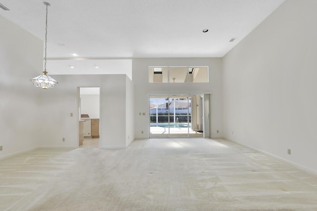 135 Eagleton Ct, Palm Beach Gardens, FL 33418 - unfurnished living room with light carpet, baseboards, and recessed lighting