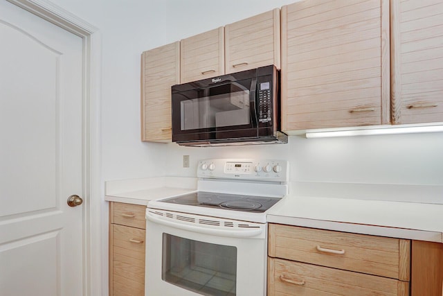 135 Eagleton Ct, Palm Beach Gardens, FL 33418 - kitchen with white electric range, black microwave, light brown cabinetry, and light countertops
