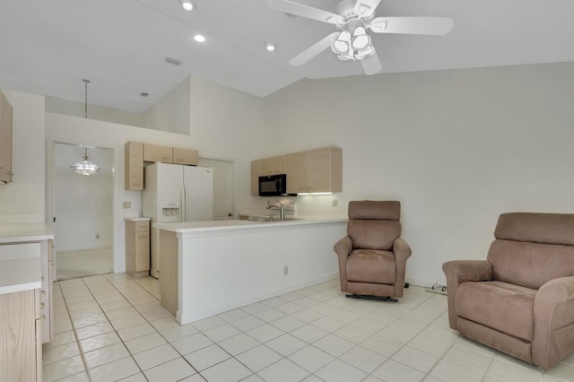 135 Eagleton Ct, Palm Beach Gardens, FL 33418 - kitchen with open floor plan, a peninsula, black microwave, light countertops, and high vaulted ceiling