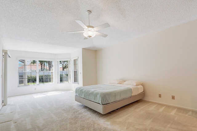 135 Eagleton Ct, Palm Beach Gardens, FL 33418 - bedroom with carpet, a textured ceiling, baseboards, and ceiling fan