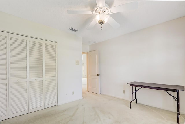 135 Eagleton Ct, Palm Beach Gardens, FL 33418 - unfurnished bedroom featuring carpet floors, a closet, and a ceiling fan