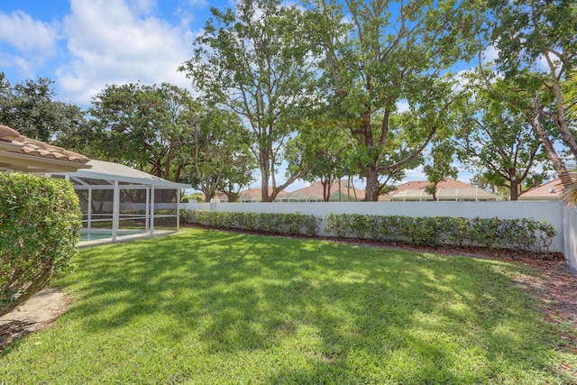 135 Eagleton Ct, Palm Beach Gardens, FL 33418 - view of yard featuring glass enclosure