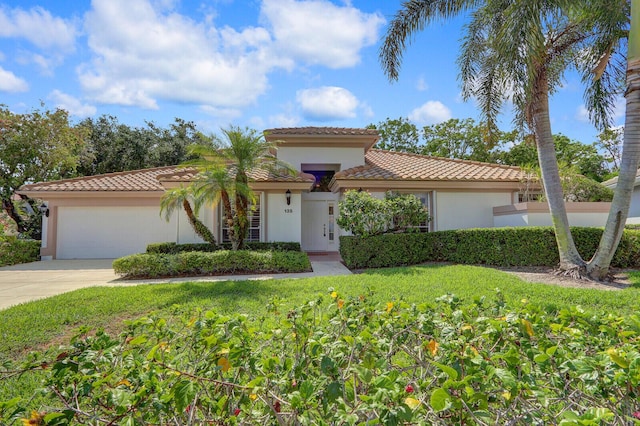 135 Eagleton Ct, Palm Beach Gardens, FL 33418 - mediterranean / spanish-style house featuring a tiled roof, stucco siding, and a garage