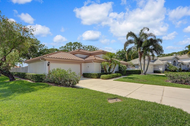 135 Eagleton Ct, Palm Beach Gardens, FL 33418 - mediterranean / spanish-style house featuring a tiled roof, driveway, an attached garage, a front yard, and stucco siding