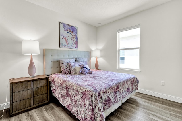6020 Wild Olive Way, Vero Beach, FL 32966 - bedroom featuring wood finished floors and baseboards