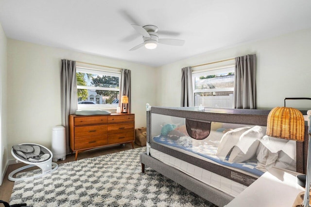 220 Fordham Dr, Lake Worth Beach, FL 33460 - bedroom featuring multiple windows, wood finished floors, and a ceiling fan