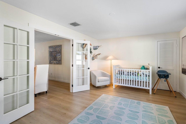 220 Fordham Dr, Lake Worth Beach, FL 33460 - bedroom featuring french doors, wood finished floors, and baseboards