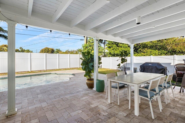 220 Fordham Dr, Lake Worth Beach, FL 33460 - fenced backyard featuring grilling area, a patio area, and outdoor dining area