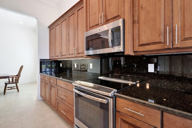 8273 Razorback Ct, Boynton Beach, FL 33473 - kitchen featuring stainless steel appliances, backsplash, brown cabinetry, dark stone countertops, and ornamental molding