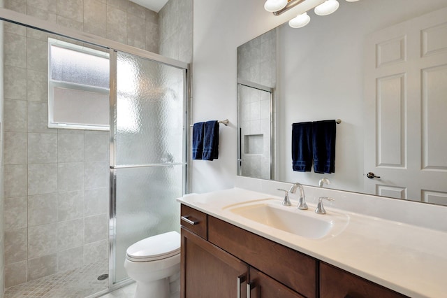 8273 Razorback Ct, Boynton Beach, FL 33473 - full bathroom featuring a stall shower, toilet, and vanity