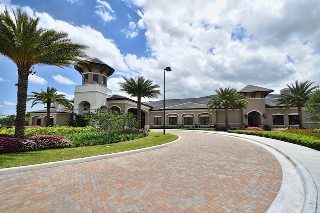 8273 Razorback Ct, Boynton Beach, FL 33473 - view of building exterior featuring curved driveway