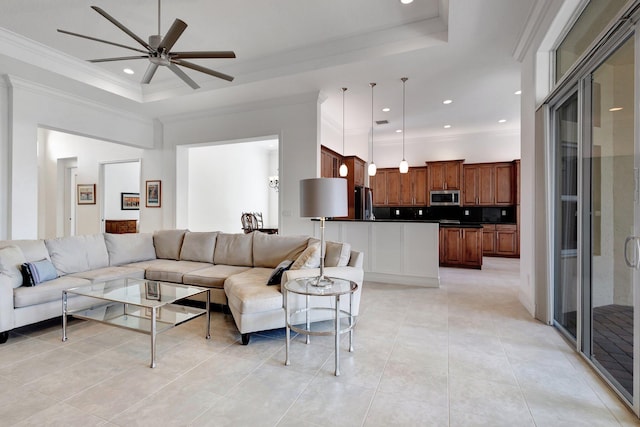8273 Razorback Ct, Boynton Beach, FL 33473 - living area featuring a tray ceiling, light tile patterned floors, ceiling fan, crown molding, and recessed lighting