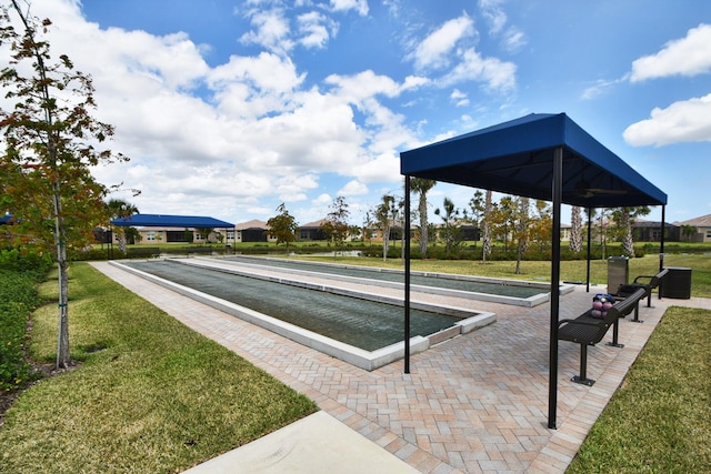 8273 Razorback Ct, Boynton Beach, FL 33473 - view of home's community with a bocce ball area and a lawn