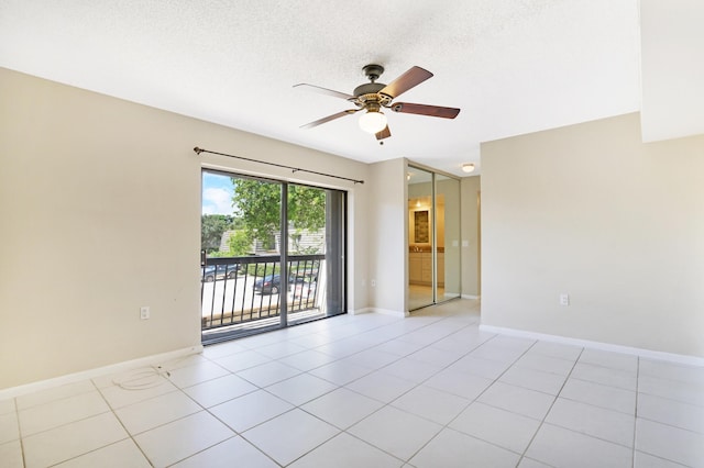 707 7th Ter, Palm Beach Gardens, FL 33418 - empty room with a ceiling fan, baseboards, a textured ceiling, and light tile patterned flooring